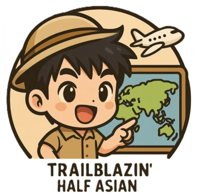 The Trailblazin’ Half Asian mascot: a young explorer in a safari hat pointing at a world map