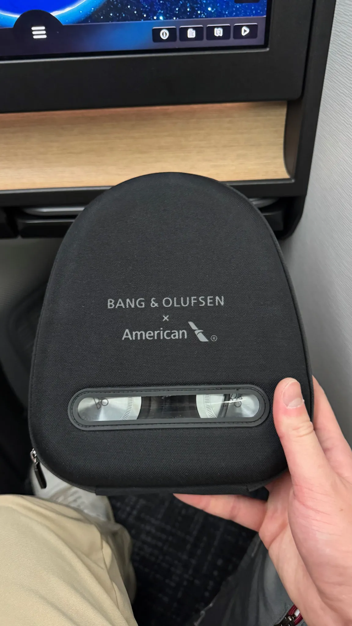 Bang & Olufsen headphones, neatly packaged for the journey.