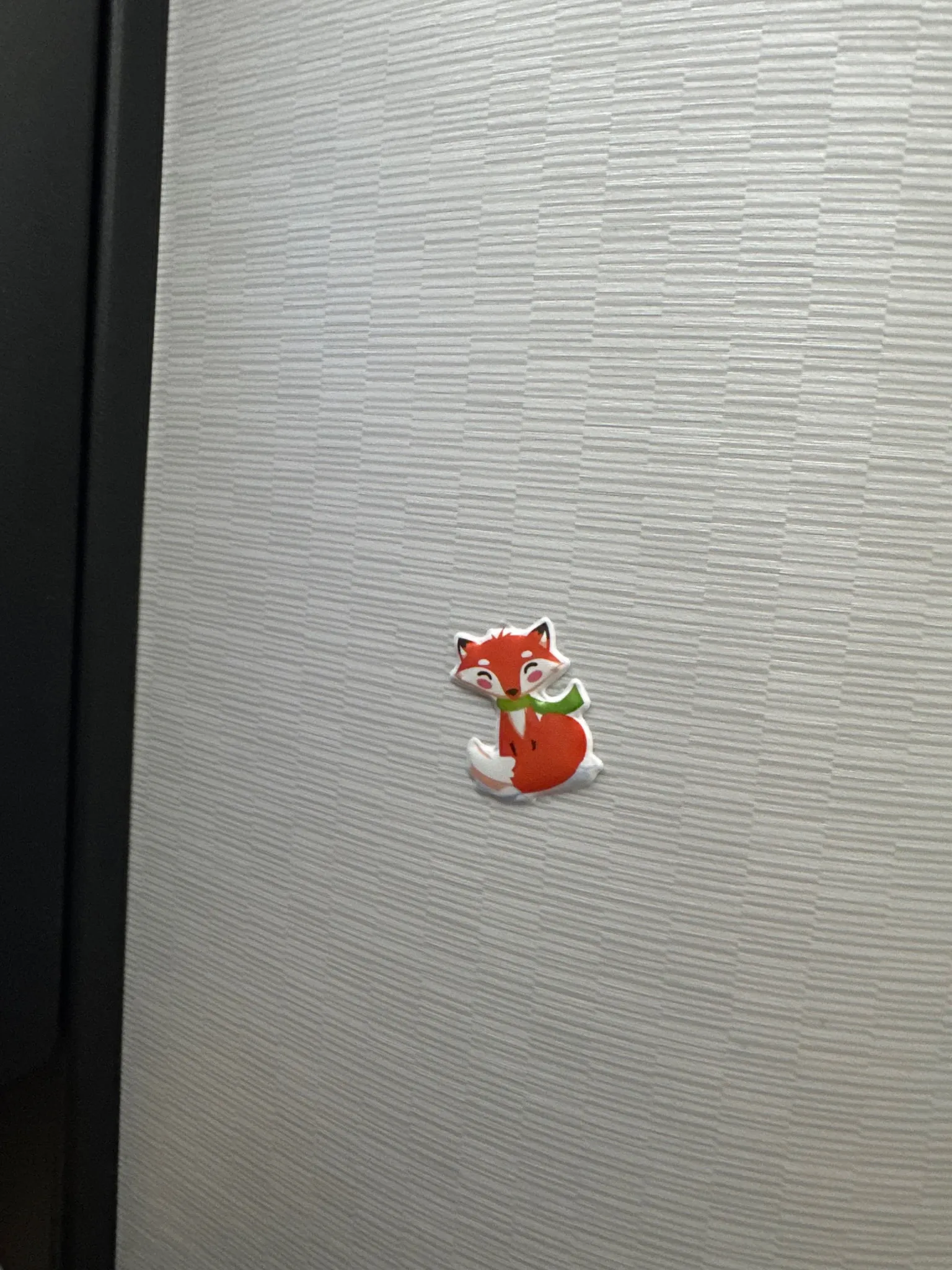 A tiny fox sticker left by a previous passenger. Cute!