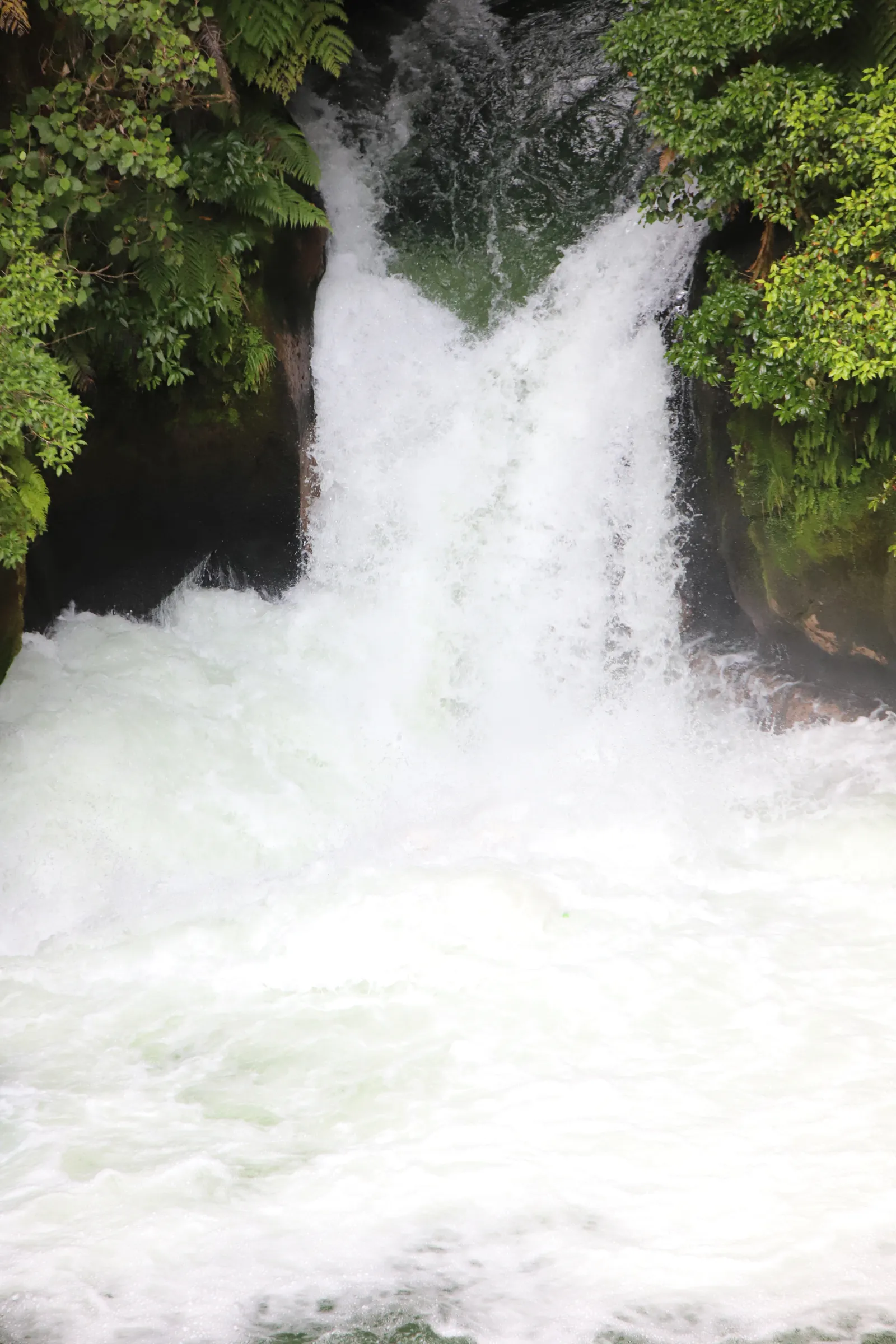 Spot the raft? You can’t, but it’s there. We’re completely underwater at the bottom of Tutea Falls.