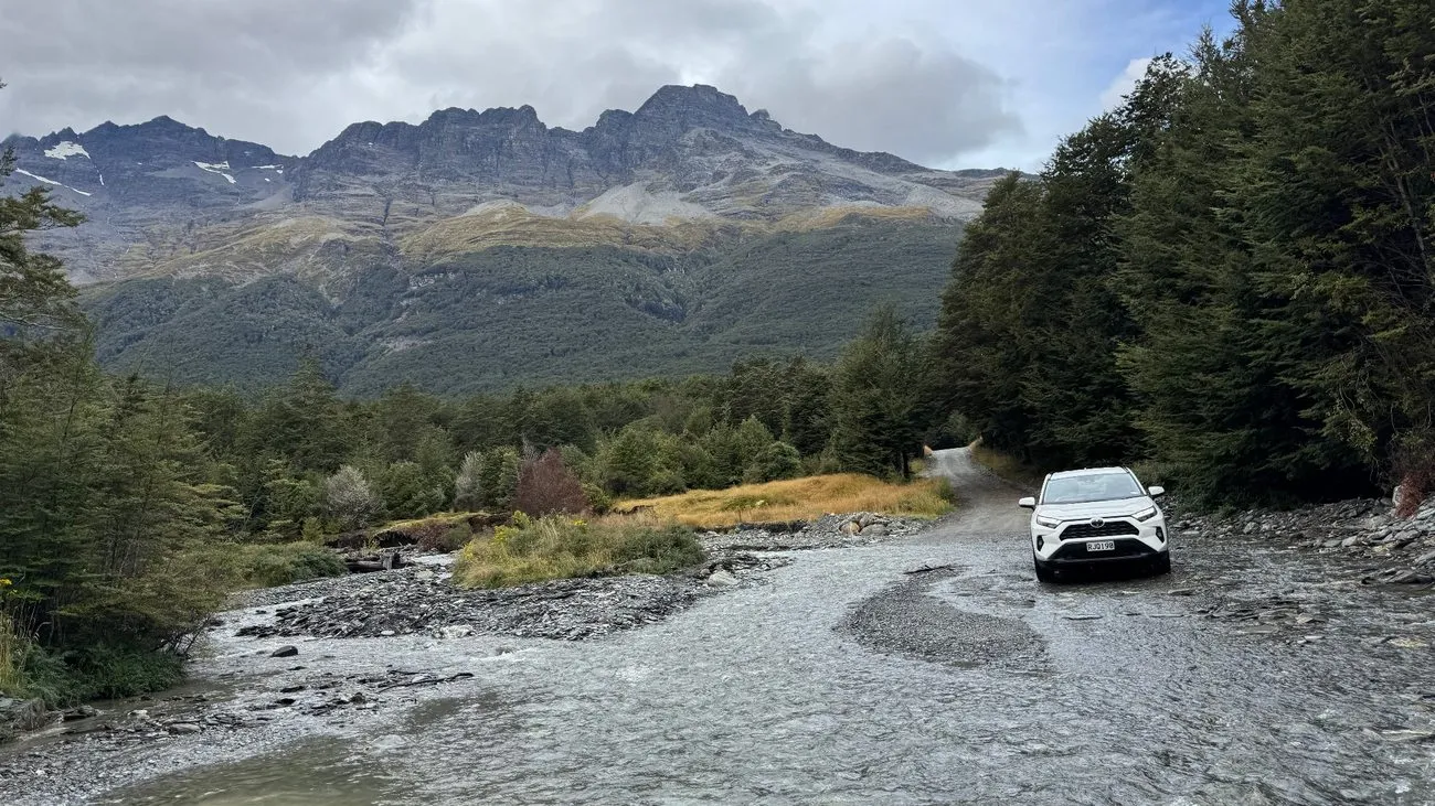 Our SUV crossing a stream on the Glenorchy-Paradise Road. The water flow picked up after more rain.
