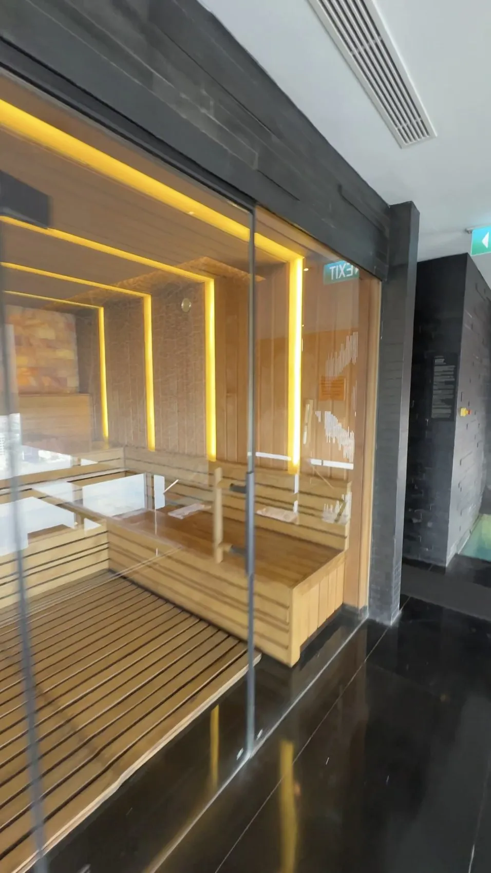 The glass-fronted sauna is one of the spa’s many useful wellness amenities.