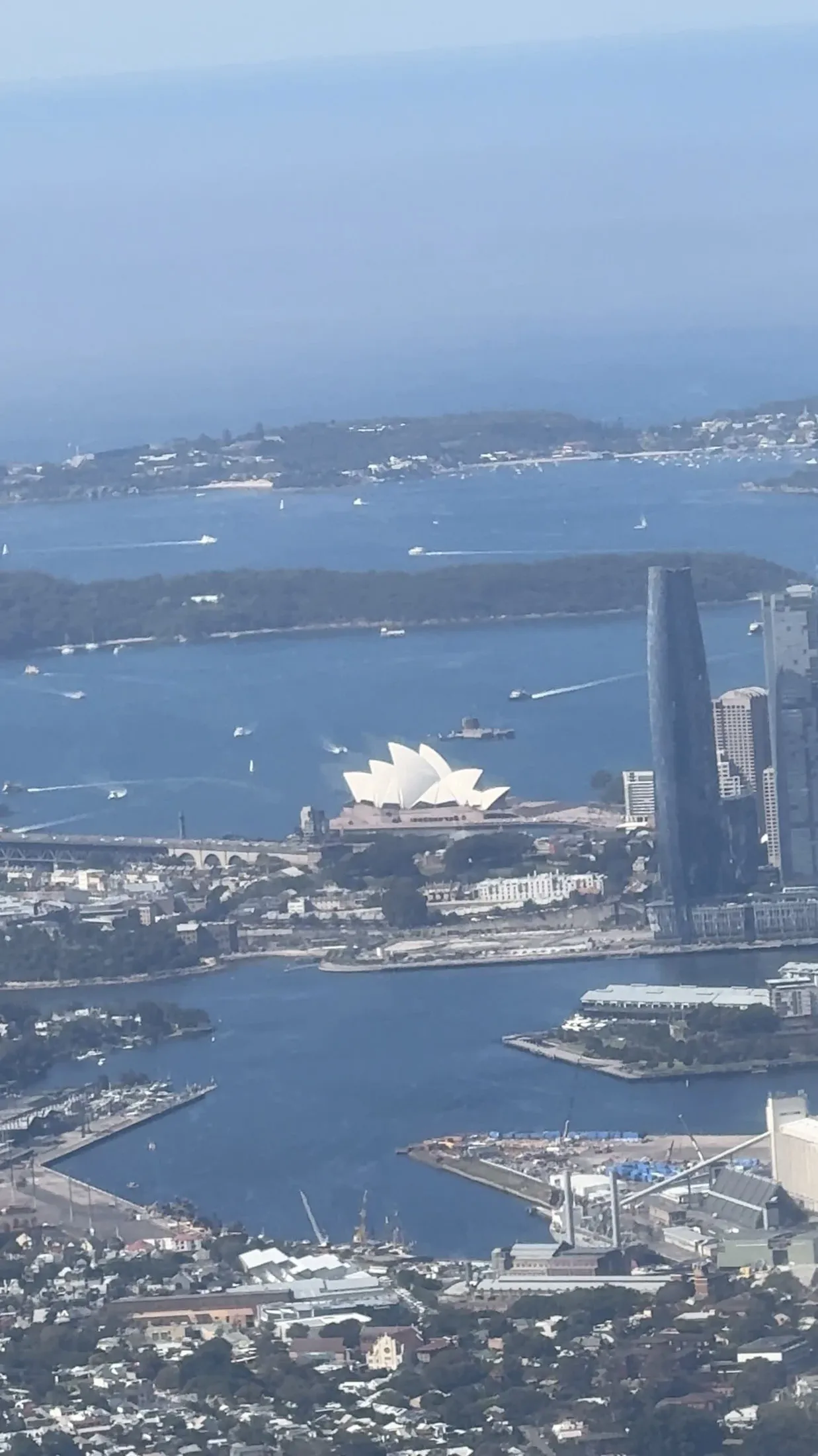 Sydney Harbour and the Opera House right after takeoff.