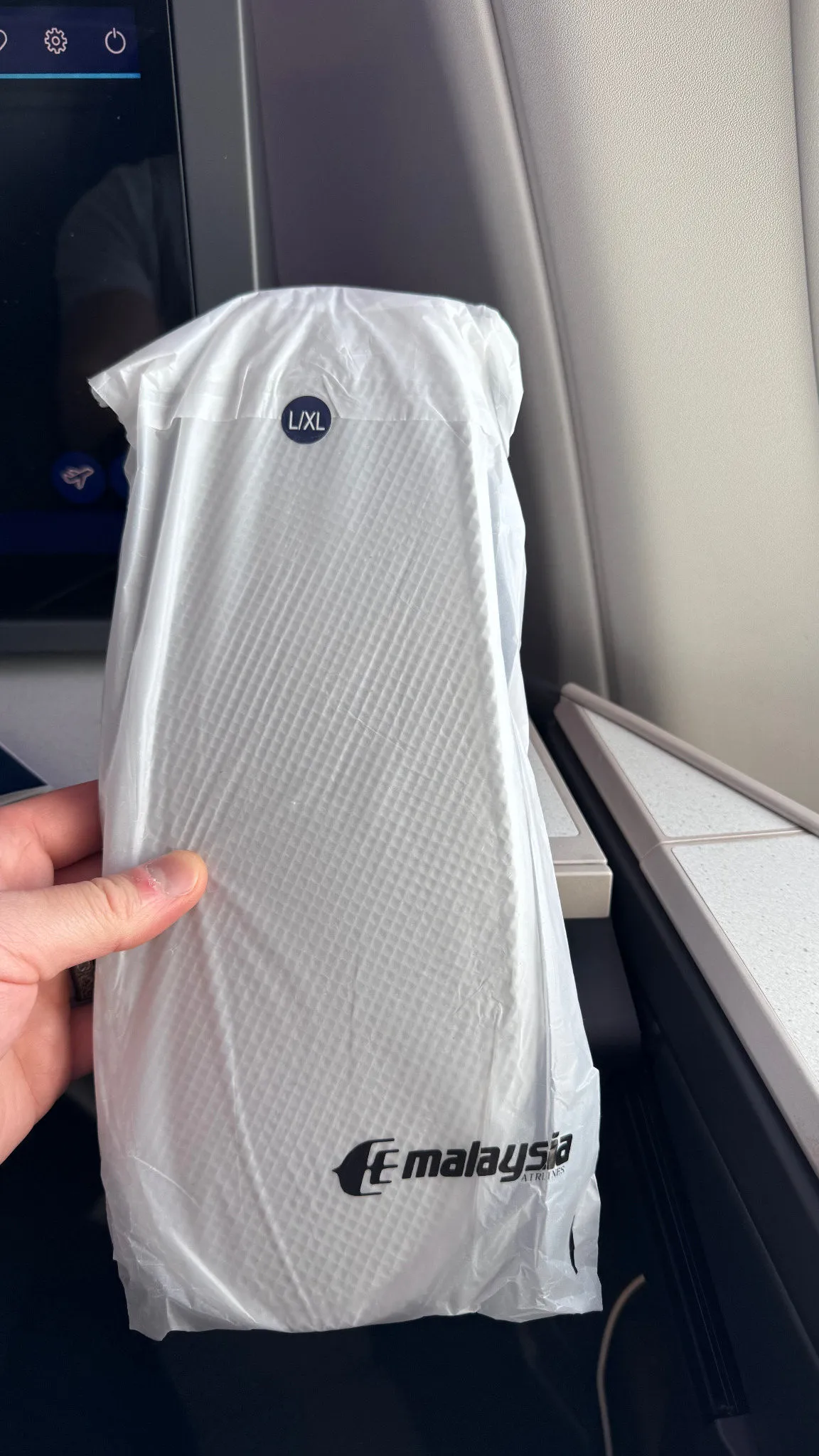 Malaysia Airlines slippers, packed in an L/XL size.