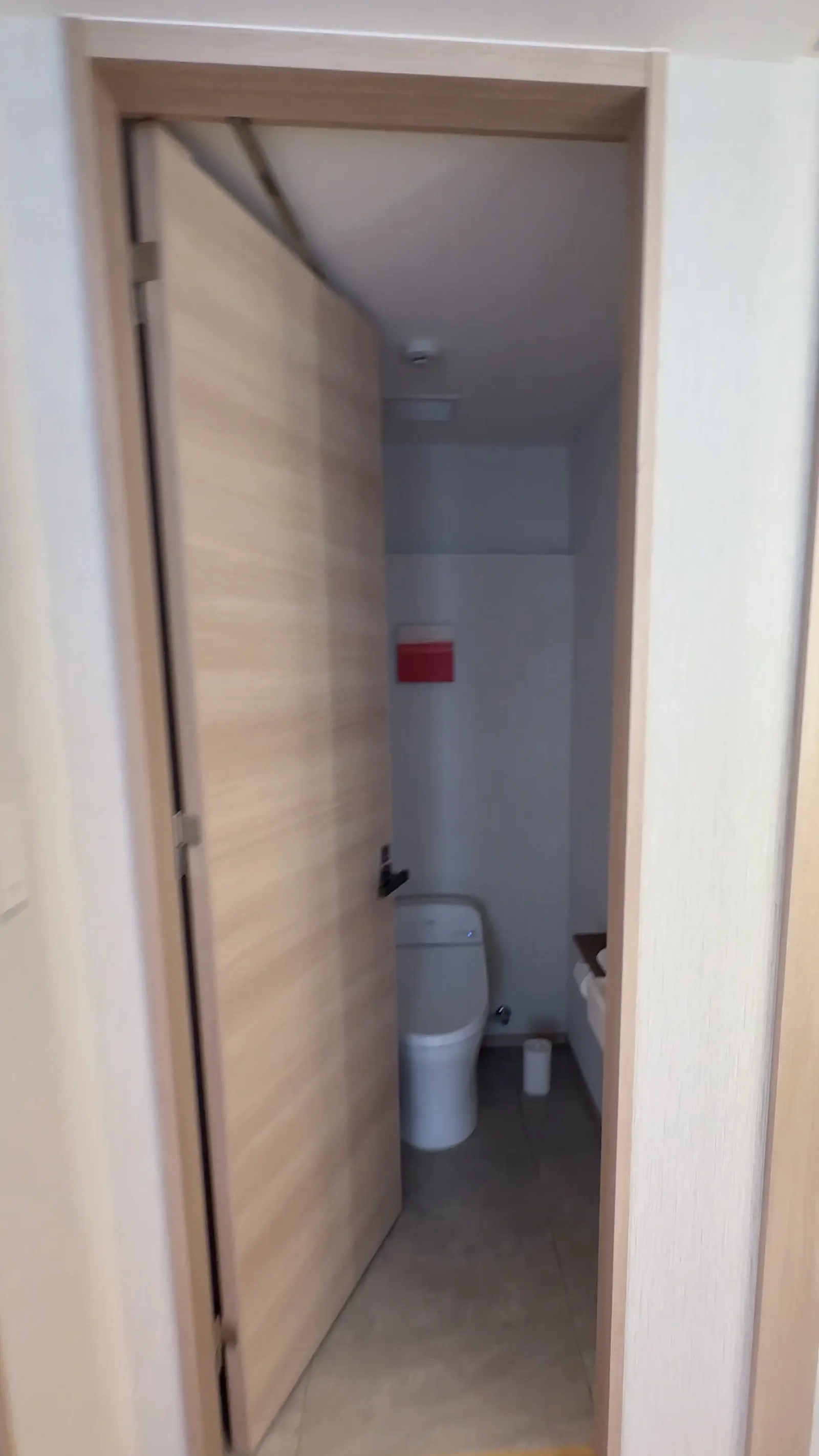 The toilet has its own separate room.