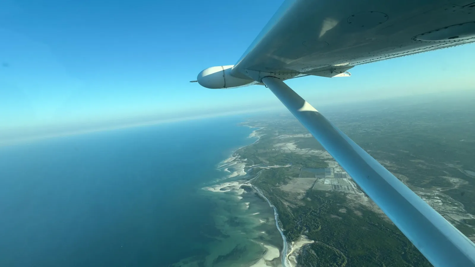 The Tanzanian shoreline and waterways through the window of our Cessna.