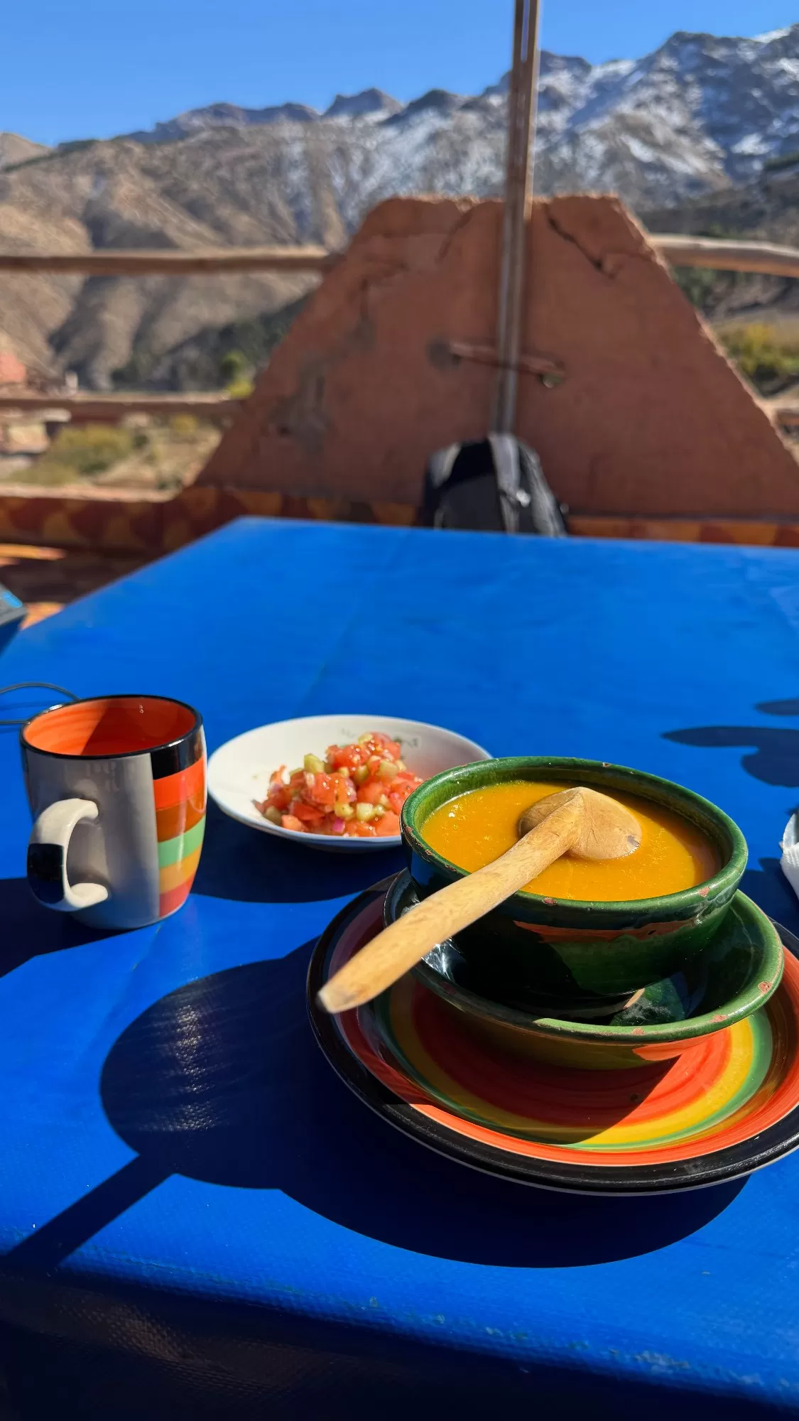 Starting our traditional Berber lunch with a warm bowl of Moroccan vegetable soup and a refreshing tomato and cucumber salad, all while overlooking the Atlas M…