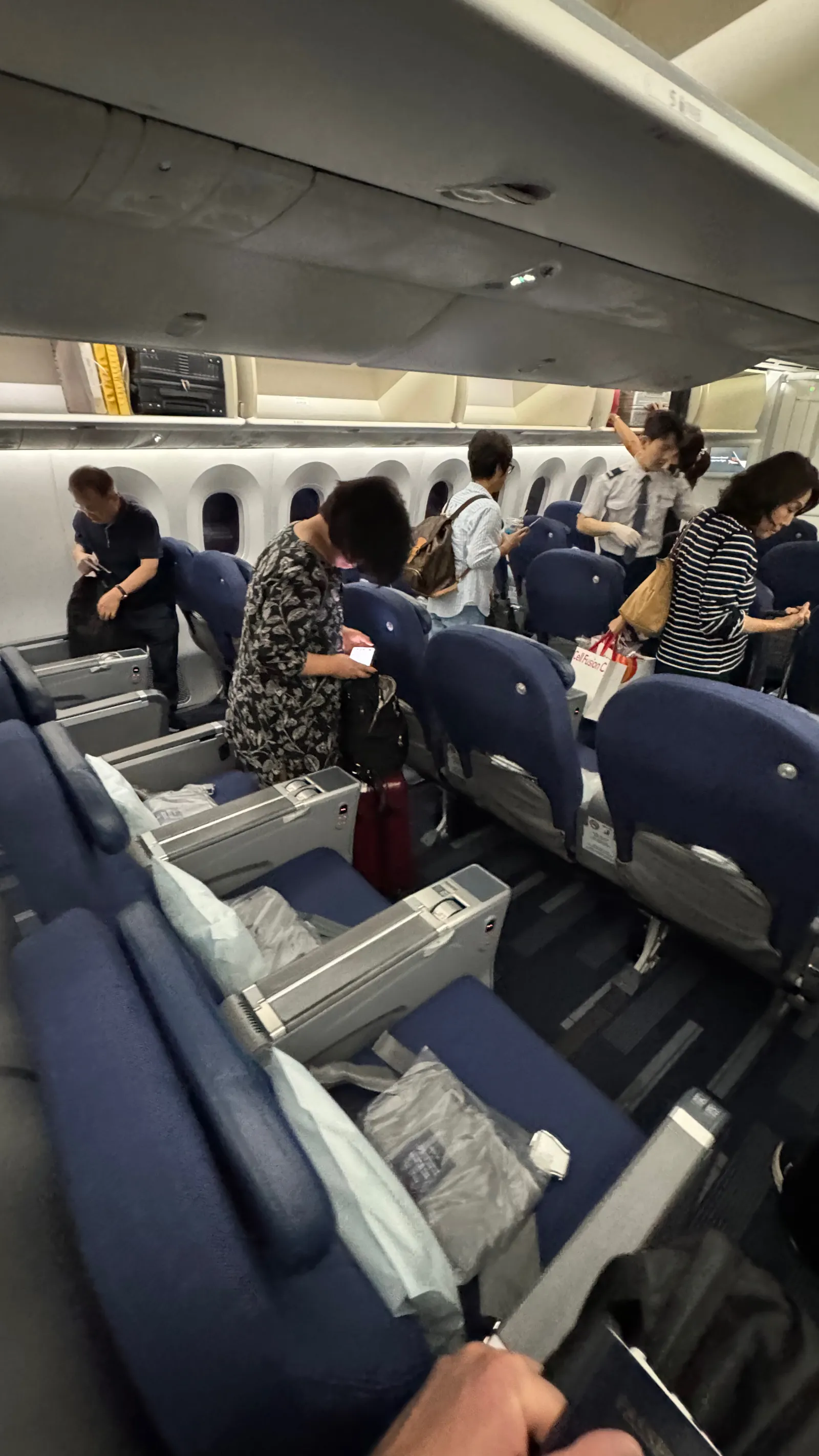 Boarding the 787-9: Wide Premium’s navy seats in a 2-3-2 layout.