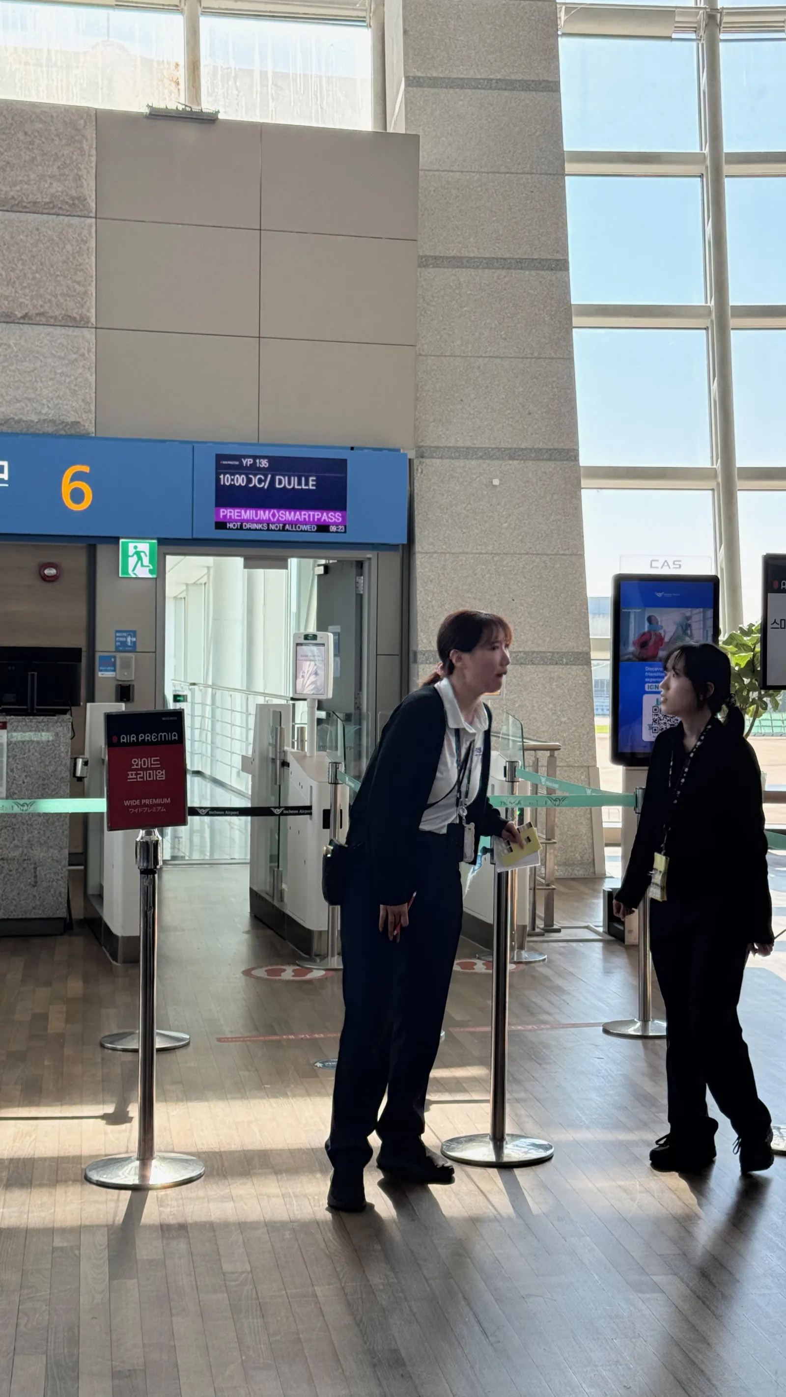 Air Premia staff getting ready for boarding at gate 6.