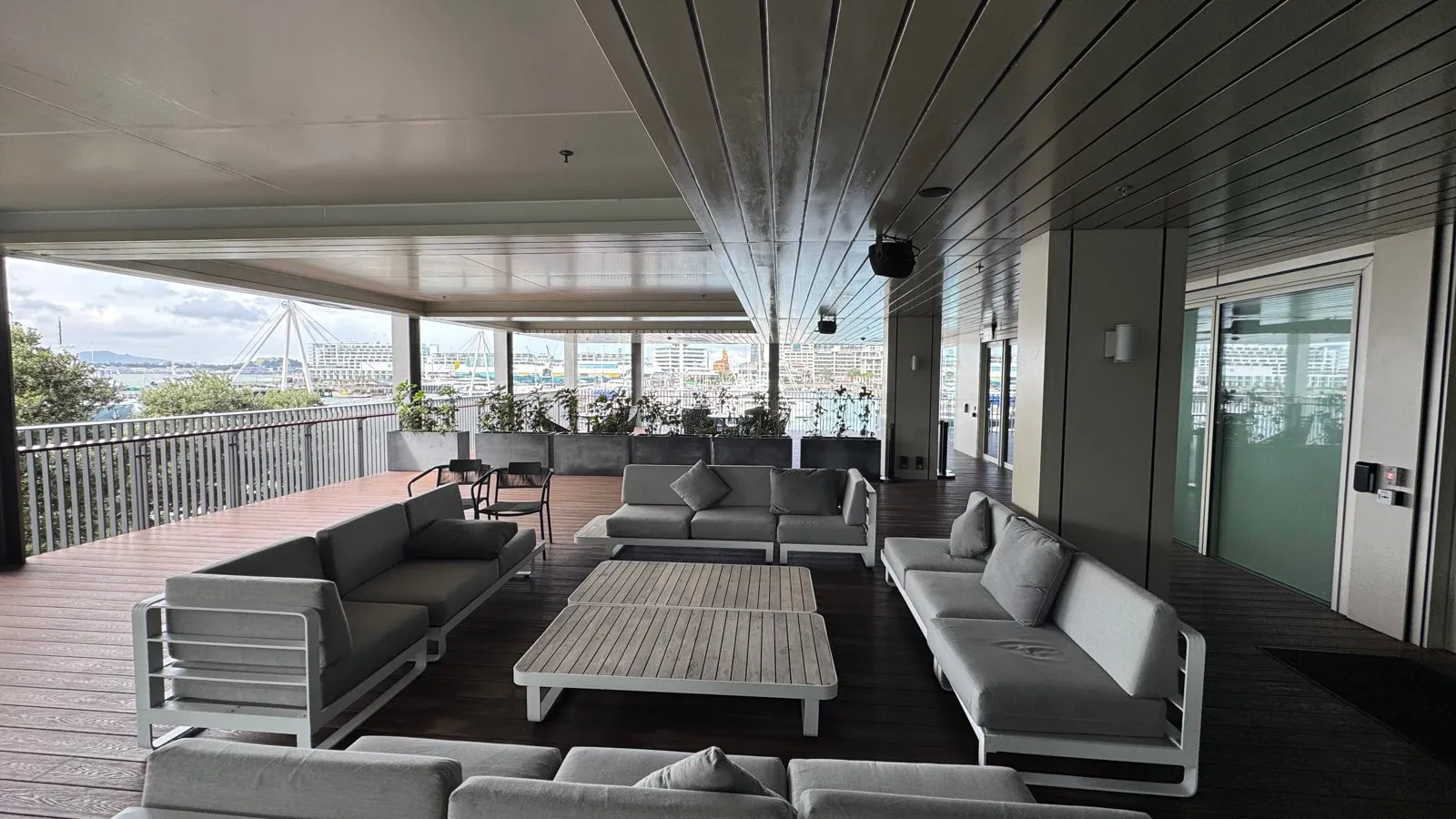 The covered terrace lounge overlooking the marina